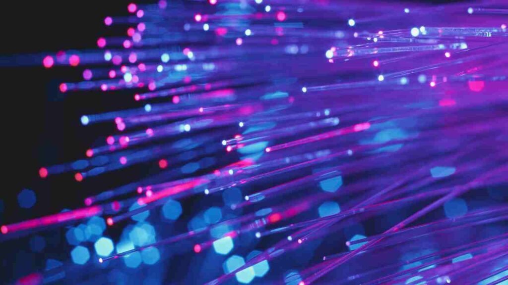 Close-up view of a fiber optic cable showcasing its intricate strands and vibrant colors.