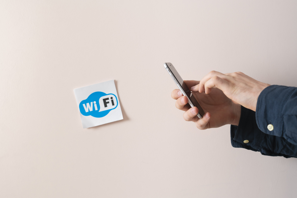 a sign of wi-fi on the wall, abstract sticker attached in public place